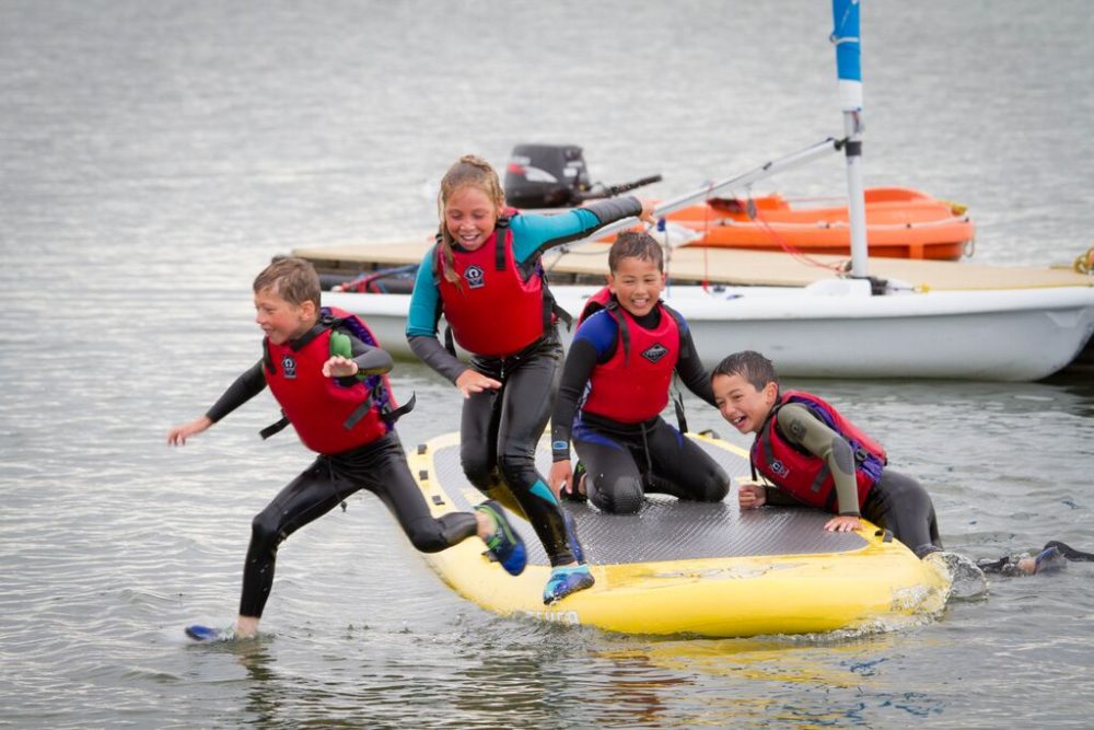 Kids Jumping off Large SUP in to Marine Lake